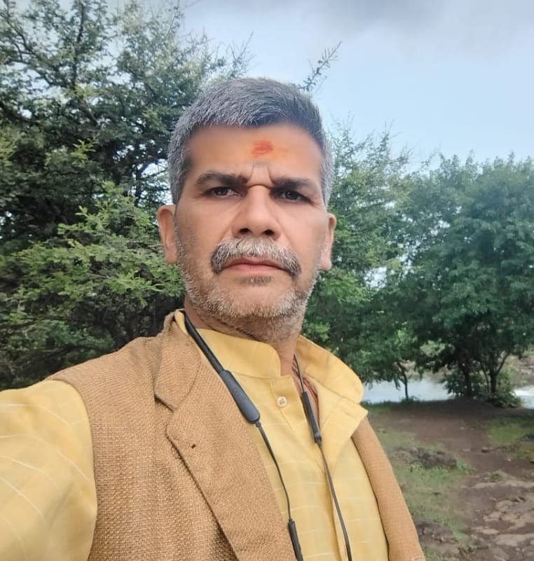 Pandit Gopal Krishna Sharma Ji, a respected Vedic astrologer and purohit from Ujjain, smiling warmly