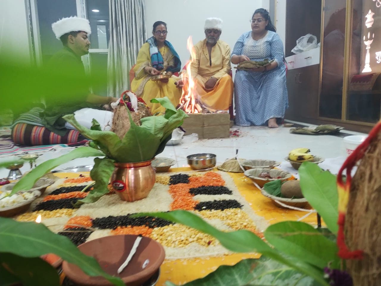 Family participating in a puja ceremony